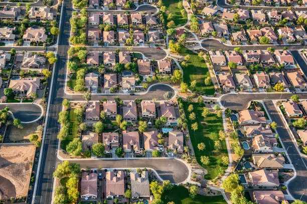 Aerial view looking directly down on group of homes in a planned exclusive residential community in the Scottsdale area of Arizona.