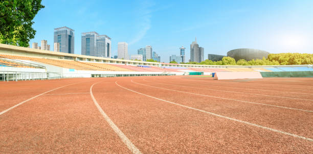istock Stadium track and modern city skyline in Shanghai 1092040536