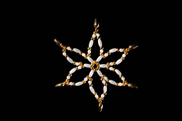 Handmade star used for decorating a christmas tree, black background