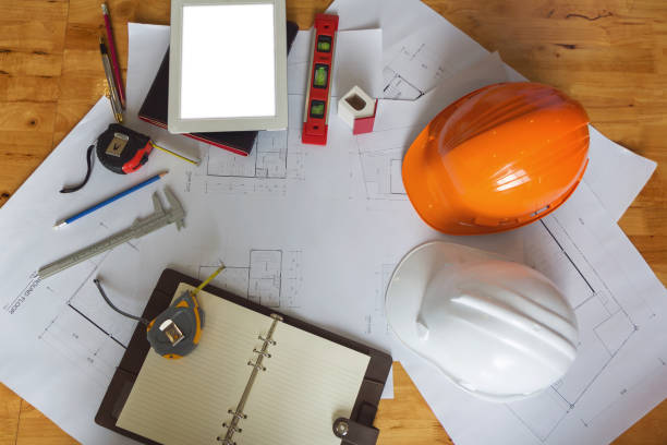 istock Engineer and Architect concept, Engineer Architects and real estate agent office team working with blueprints 1092049132