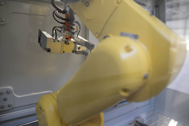 istock Manager engineer check and control automation robot arms machine in intelligent factory industrial on real time monitoring system software. Welding robotics and digital manufacturing operation. 1092051044