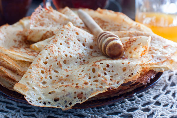 istock Fishnet thin pancakes on the table with a napkin, horizontal 1092057838