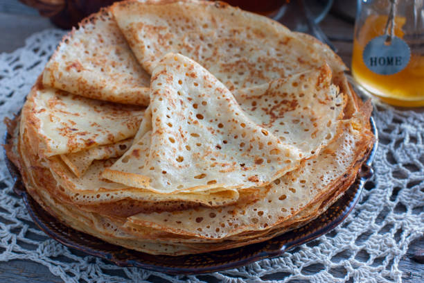 istock Fishnet thin pancakes on the table with a napkin, horizontal 1092057852