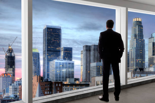 istock Businessman Looking Out The Window in Los Angeles 1092062968