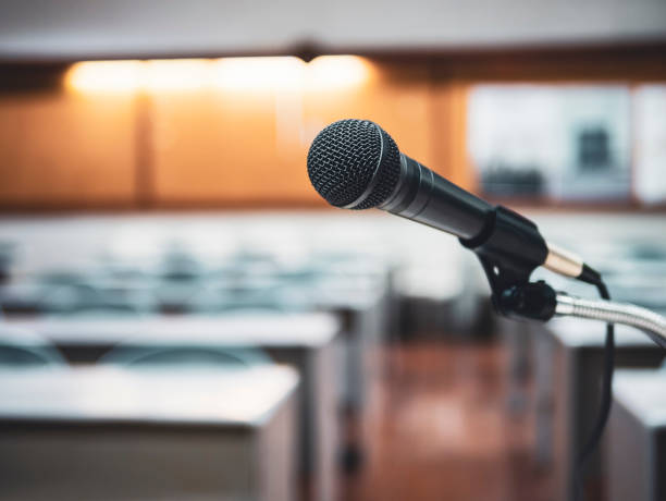 istock Microphone in Conference Seminar room Meeting Event Background 1092065466