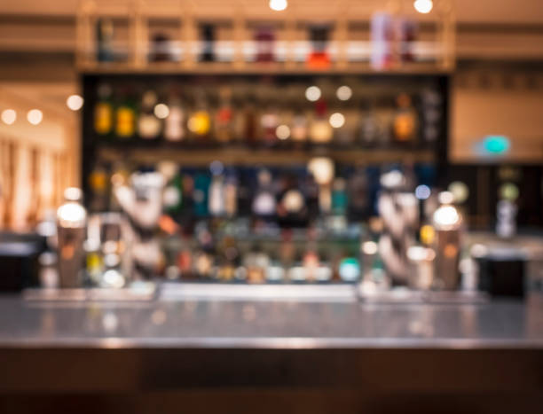 Table top counter Blur Bar pub restaurant Party Background Table top counter Bar pub restaurant Blur cocktail shelf colourful Party background wine bar counter stock pictures, royalty-free photos & images
