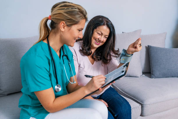 istock Medic taking blood pressure during home visit 1092066830