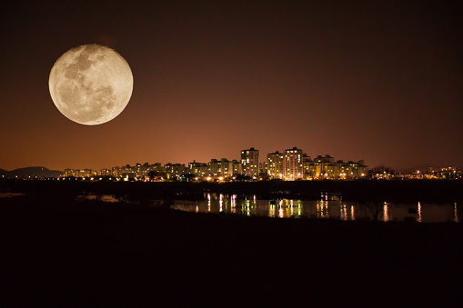 Fanciful Super Moon (full moon), Beautiful cityscape at night in Daegu, Korea.