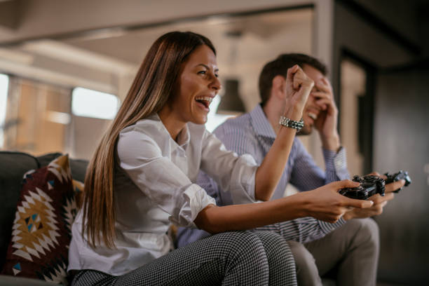 istock Happy couple playing video games 1092080568