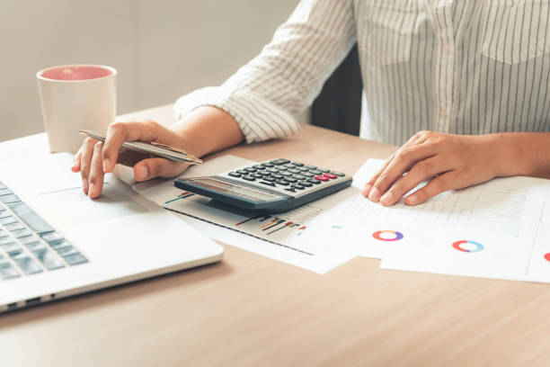 istock Business financial analyzing and planning calculation for investment on table desktop.,Businesswoman accountant is working and making tax document information for balancing budget and profit income., 1092081116