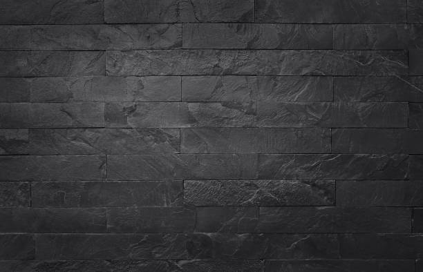 istock Dark grey black slate texture in natural pattern with high resolution for background and design art work. Black stone wall. 1092081272