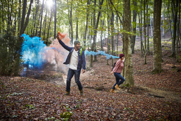 istock Happy couple with distress flares in forest 1092081900