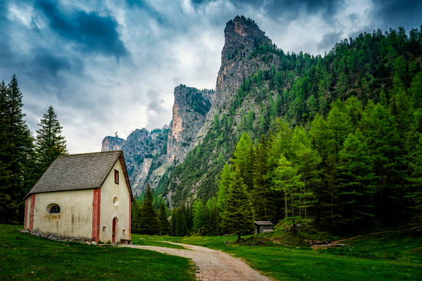 Dolomites Alpe di Siusi, Italy beautiful scenery, natural autumn landscape with house, mountain peaks