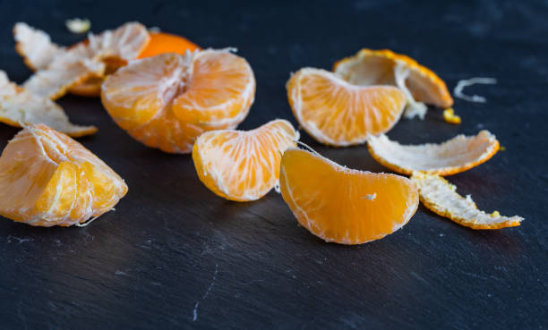 istock Mandarins and carvings on a dark background 1092090054