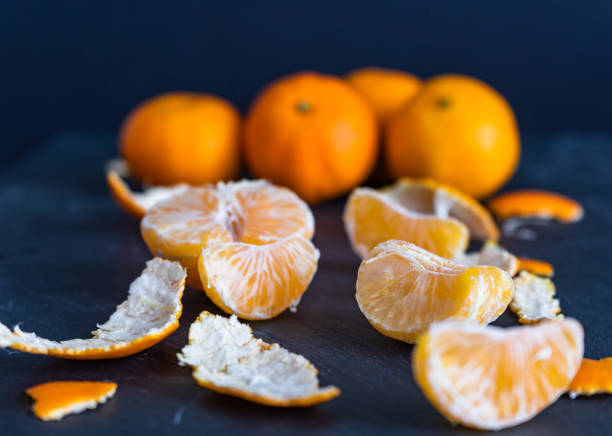 istock Mandarins and carvings on a dark background 1092090606