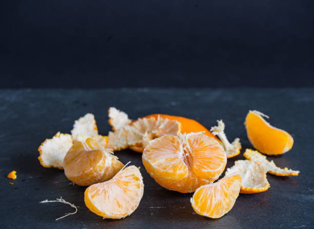 istock Mandarins and carvings on a dark background 1092091750