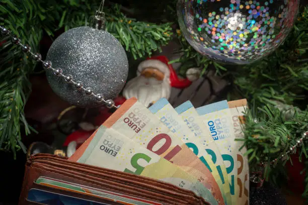 Photo of Santa Christmas ornament with Euro banknotes