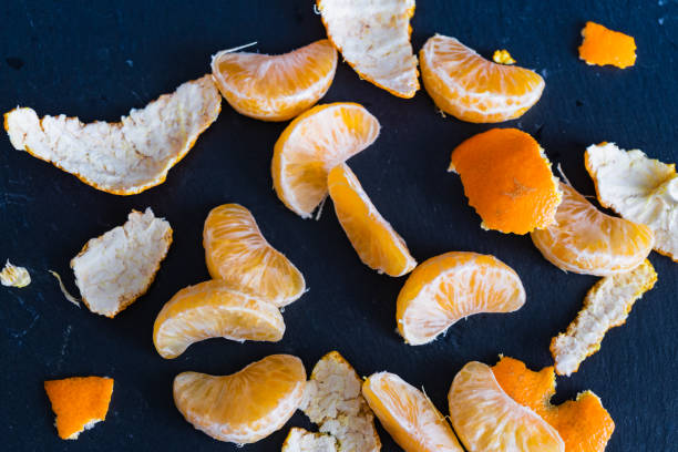 istock Mandarins and carvings on a dark background 1092092034