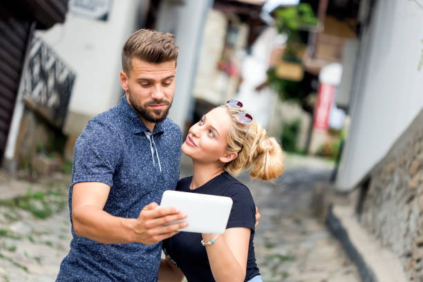 istock Happy couple making selfie outdoors 1092092320