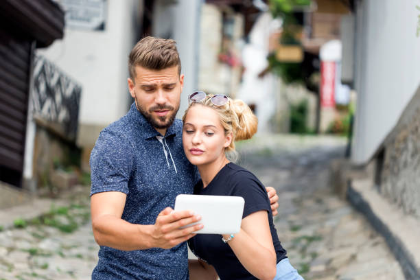 istock Happy couple making selfie outdoors 1092092334