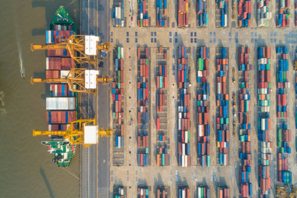 istock Logistics and transportation of Container Cargo ship and Cargo working crane bridge in shipyard 1092097414