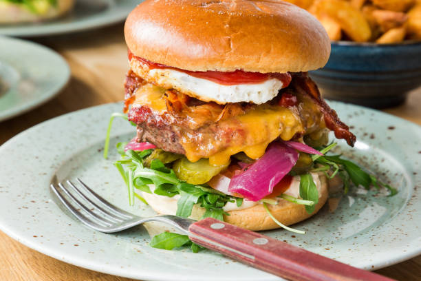 istock Juicy american hamburger with cheese, grilled ground meat, toppings 1092100352