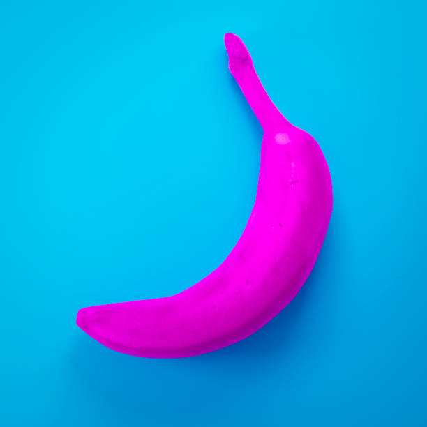 istock a pink banana on turquoise background 1092100832