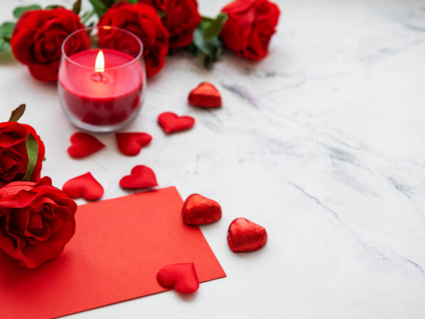 istock Valentines day romantic background - red roses, candle and hearts 1092101126