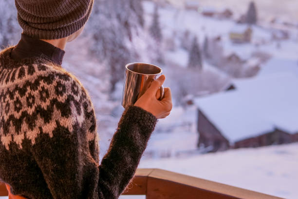 istock Young woman drinking tea or coffee with nature on background 1092102796