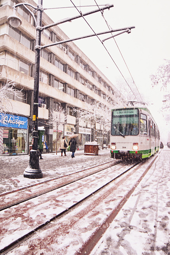 Scenes from everyday street life in Turkey. Historical Tram at the 'Cumhuriyet caddesi' in a snowy winter day