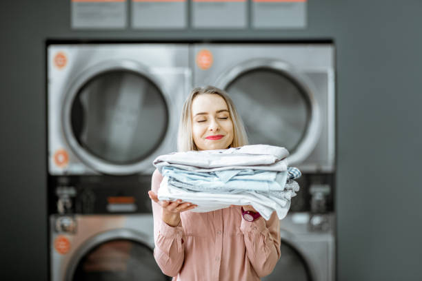 istock Woman with ironed clothes in the laundry 1092103704