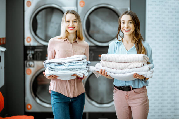 istock Women with clean clothes in the laundry 1092103714