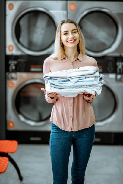istock Woman with ironed clothes in the laundry 1092103716