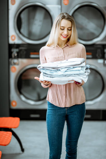 istock Woman with ironed clothes in the laundry 1092103744