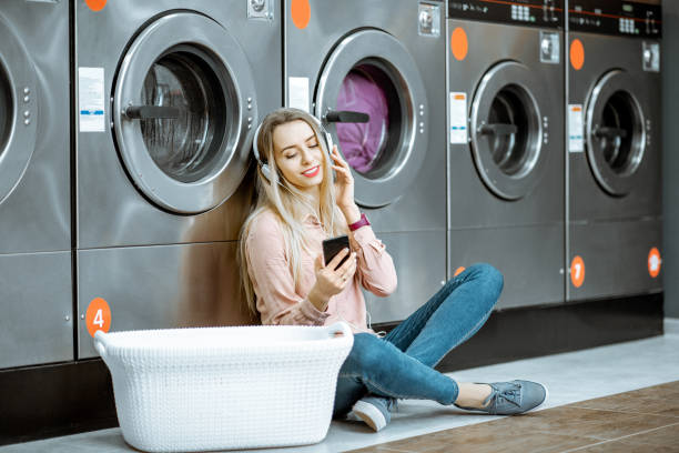 istock Woman in the self-service laundry 1092104146