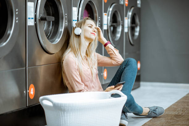 istock Woman in the self-service laundry 1092104160