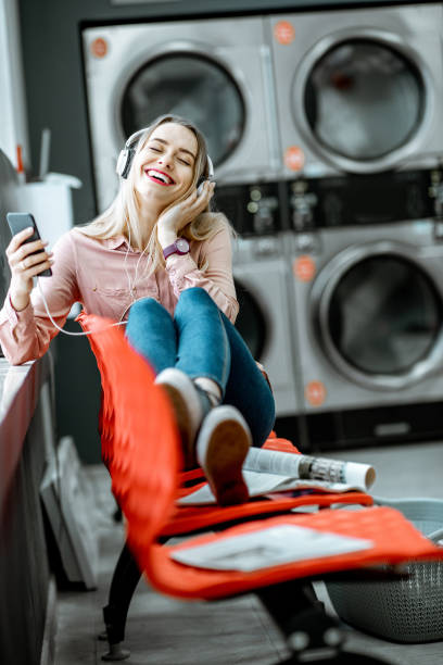 istock Woman waiting in the self-service laundry 1092104262