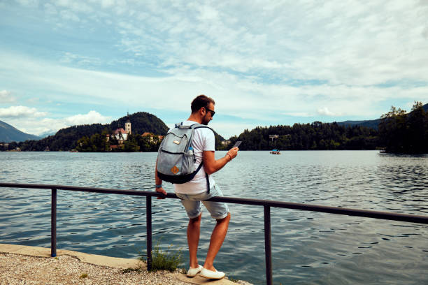 istock Modern guy using cellphone in the European city. 1092106586
