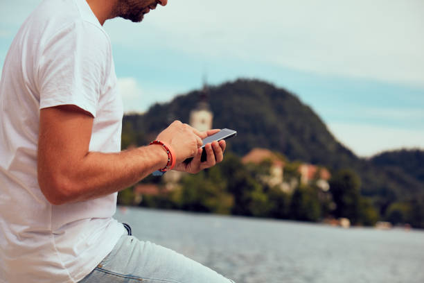 istock Modern guy using cellphone in the European city. 1092107124
