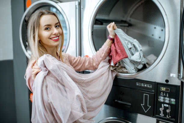 istock Happy woman in the laundry 1092107142