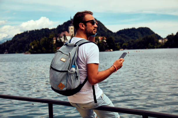 istock Modern guy using cellphone in the European city. 1092107588