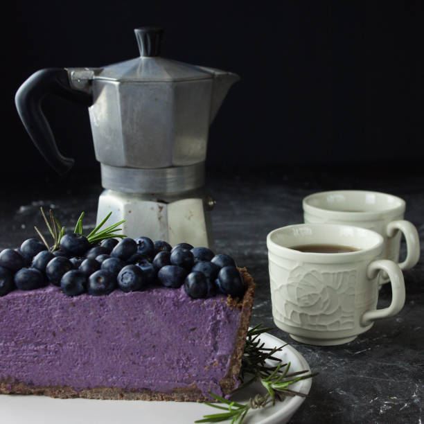 Blueberry vegan cheesecake. Dark photo on black background