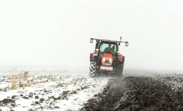 istock Tractor plowing a field in winter 1092109812