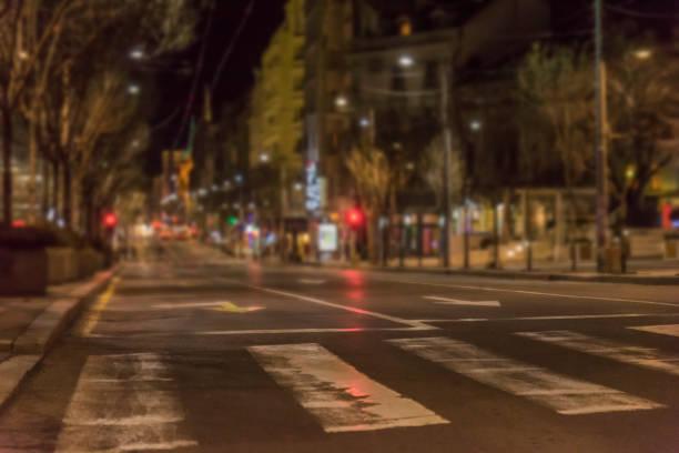 istock Night scene with pedestrian  in foreground and illuminated building 1092112372