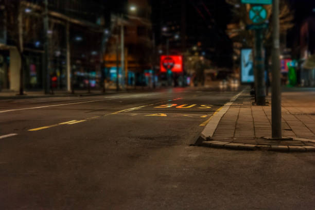 Night street scene with illuminated building architecture