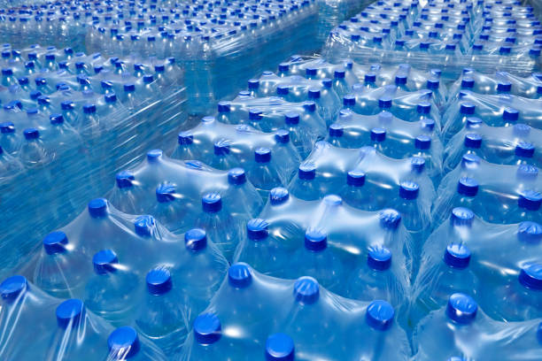 istock Many packaged blue mineral water bottles in stock 1092112748