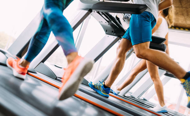 istock Group of friends exercising on treadmill machine 1092114926