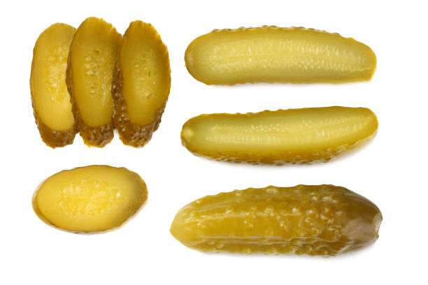 istock sliced marinated pickled cucumbers isolated on white background. top view 1092115282