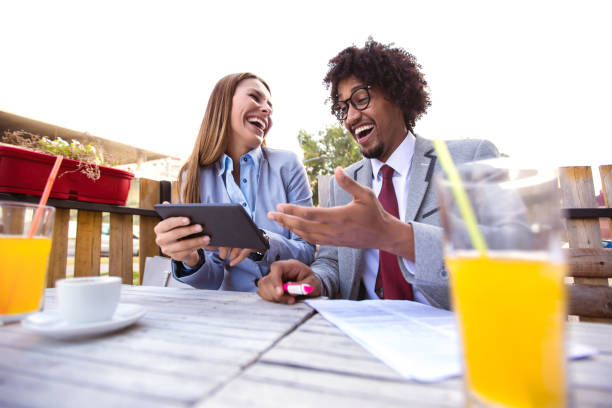 istock Business people looking at digital tablet and discuss about the future project plan in outdoor cafe. 1092115906