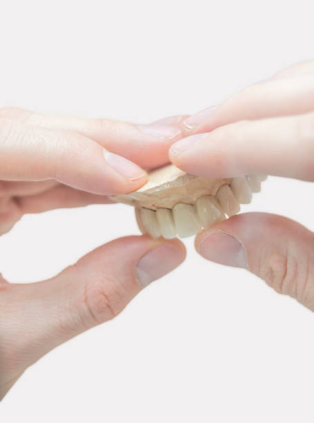 istock Tooth dental technician prosthetic manufacturing isolated on white 1092116666